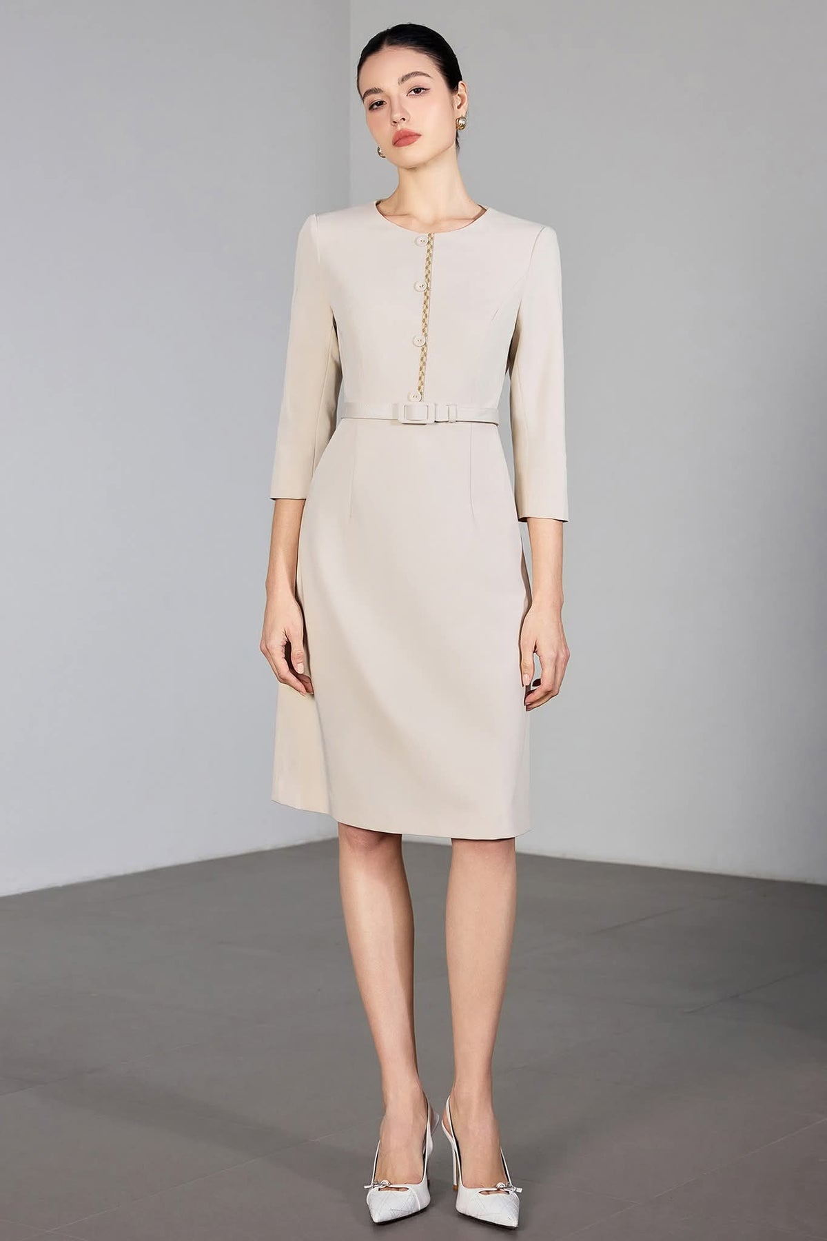 Ivory Poise Midi Dress Tailored Beige Dress with Gold Detail – another front view, worn by a model