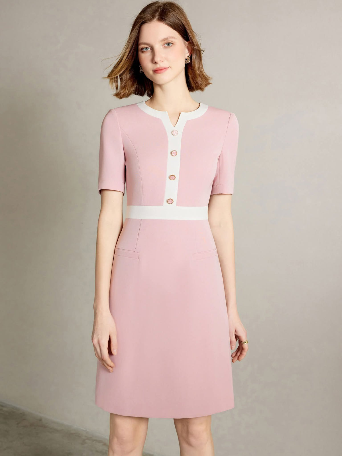 Rosewood Blush Pink Tailored Dress with Gold Button Detail – front view, worn by a model
