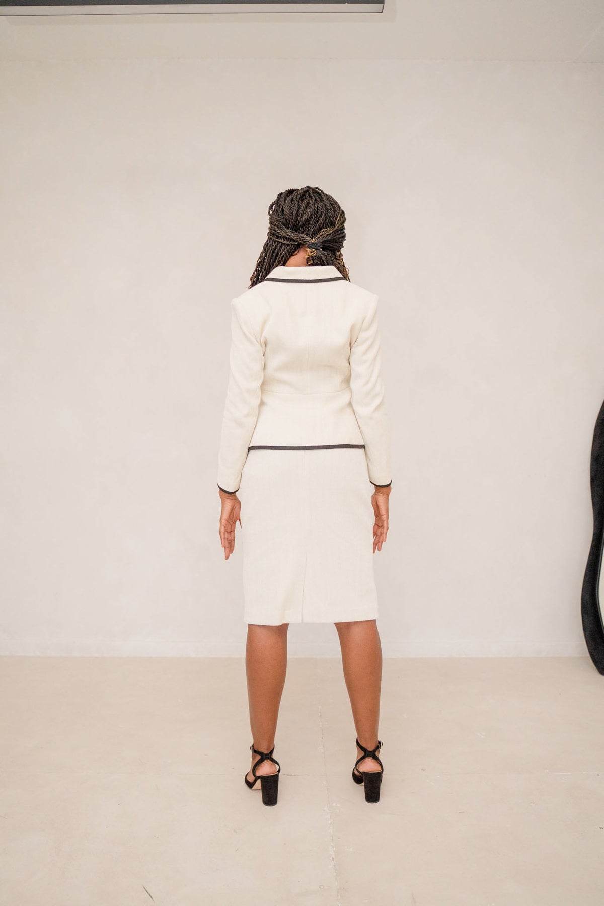 Beige Piped Peplum Tweed Skirt Suit Women’s Chequered Blazer Set – back view, worn by a model