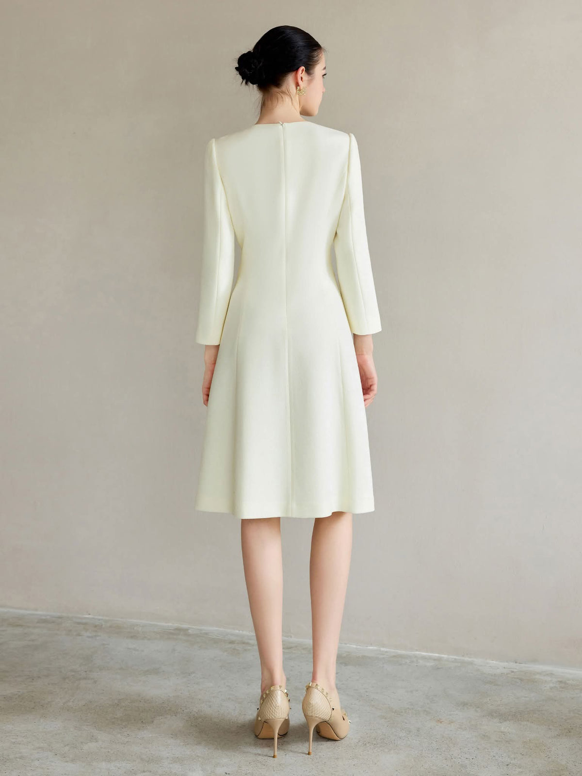 Ivory Regal Coat Dress Pearl Buttons Tailored A-Line Elegance – back view, worn by a model