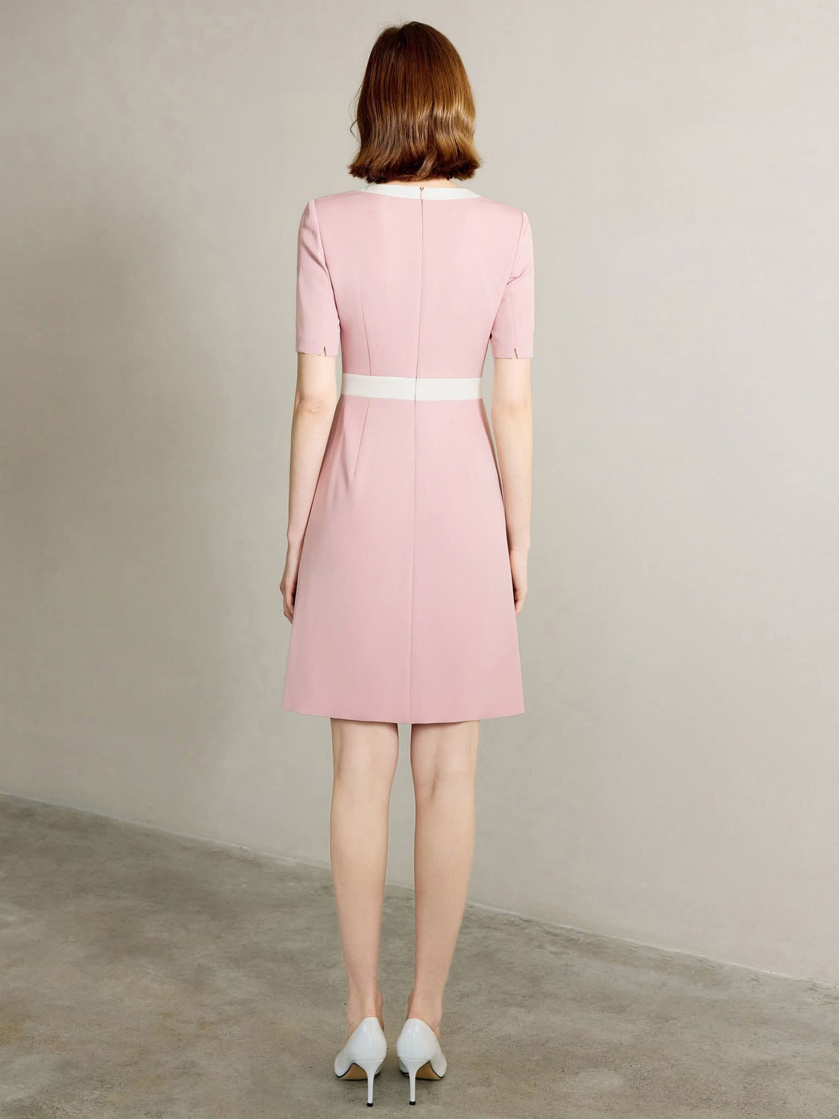 Rosewood Blush Pink Tailored Dress with Gold Button Detail – back view, worn by a model