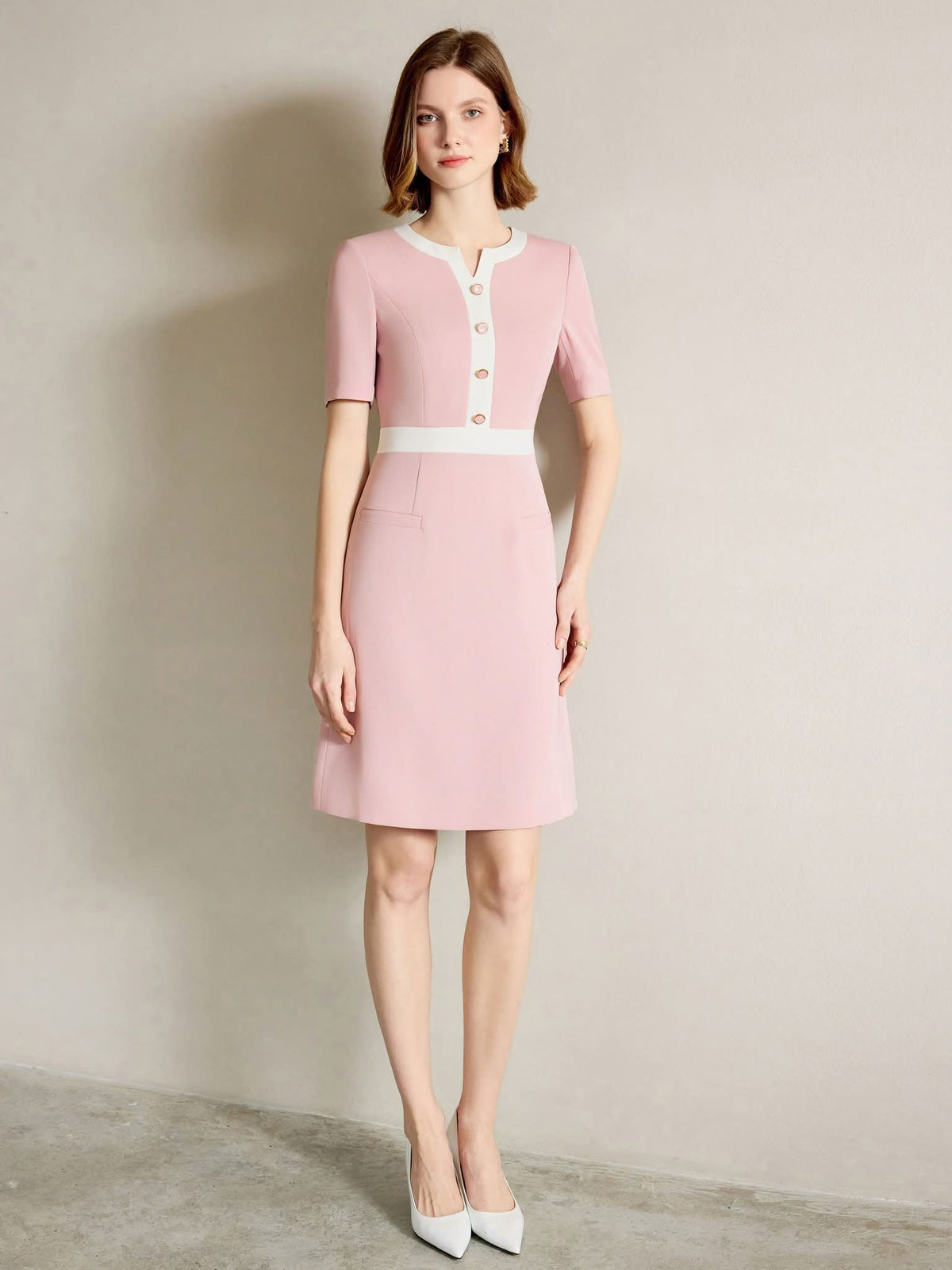 Rosewood Blush Pink Tailored Dress with Gold Button Detail – another front view, worn by a model