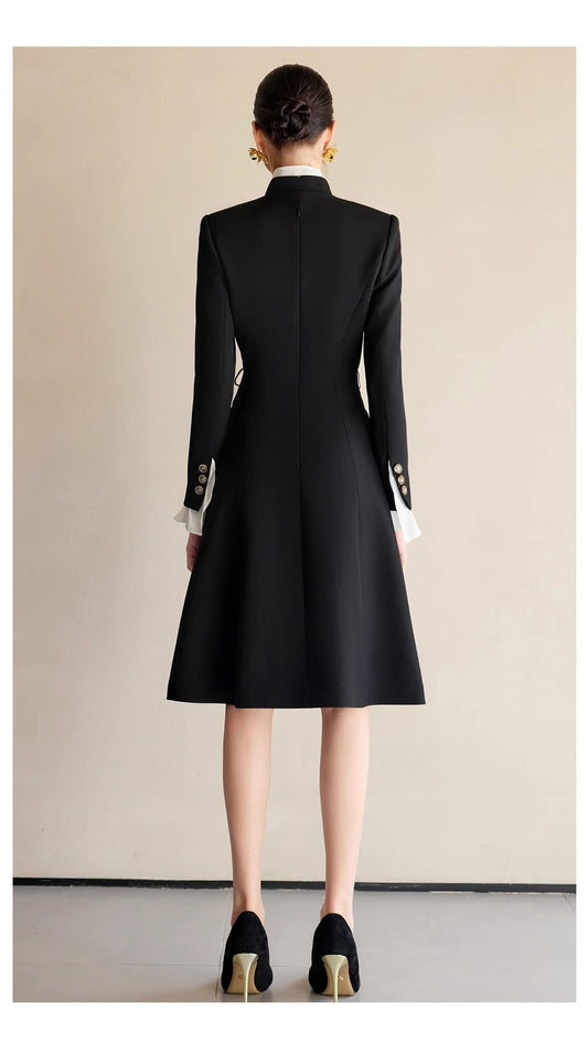 The Contrast-Ruffle Black Dress Tailored A-Line Long Sleeve Ankle-Length – back view, worn by a model